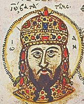 Head portrait of a middle-aged man with a dark, forked beard, wearing a golden, jewel-encrusted domed crown