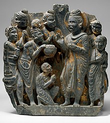 Probably The Gift of Anathapindada, 2nd-3rd century, Gandhara. This panel retains some of the gilding that many Gandharan reliefs probably originally had. MET DT8660 (cropped).jpg