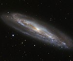 Messier 98 tagen av ESO’s New Technology Telescope.[12]