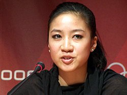 An Asian woman talking.