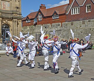 Morris dance An English folk dance, accompanied by music