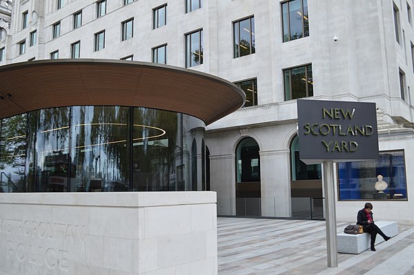 The iconic sign outside the New Scotland Yard building on Victoria Embankment, City of Westminster. The sign came to prominence when it was first loca