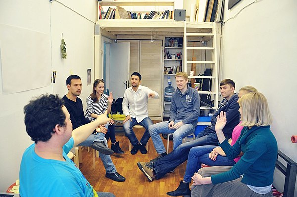 Party guests playing a game of Mafia