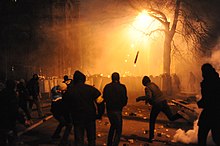 Violent clashes erupt between protesters and police Protesters throwing pieces of paving during and metal tubes at riot police during clashes at Bankova str, Kiev, Ukraine. December 1, 2013.jpg