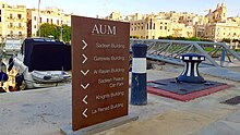 Walk path sign showing the way to the buildings on campus Sadeen Building 08.jpg