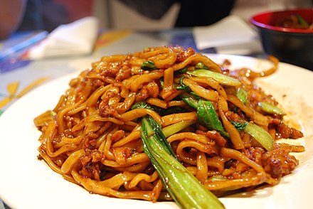 A type of fried noodles with bok choy and pork with a soy sauce base.
