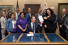 California Governor Gavin Newsom with Gonzalez at the signing of AB5 in 2019. Signing ceremony for AB5.jpg