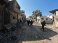 Black League PMC contractors on a security patrol in the village outskirts