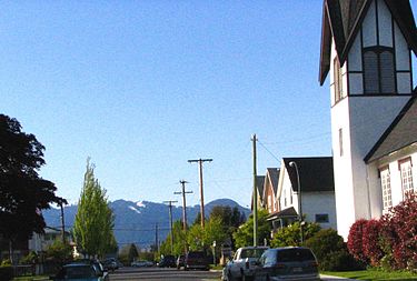 Street and houses in the Dickens neighbourhood of East Vancouver (with North Shore Mountains in background) St Catherines, 3500 block.jpg