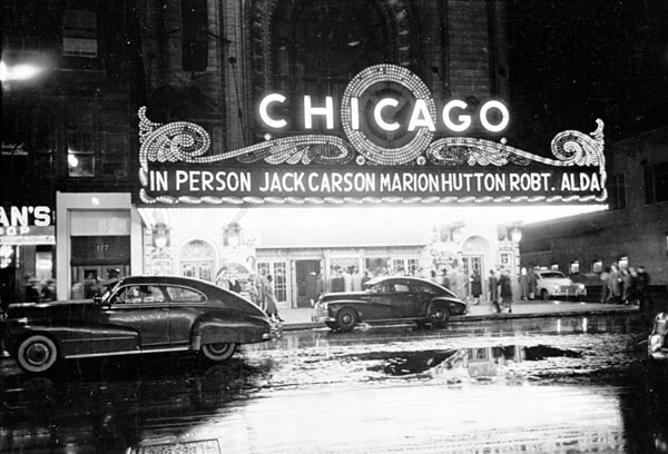 People arriving at the Chicago Theatre for a show starring, in person, Jack Carson, Marion Hutton, and Robert Alda, taken by Stanley Kubrick for Look 