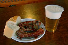 A tapa. Spain's national competition of tapas takes place each year in Valladolid. Tapa la Feria-Valladolid-2009 (Costillas).jpg