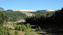 The completed replacement reservoir, viewed from the scour created by the collapse of the original.