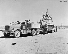 British Army M19 Tank Transporter, composed of an M20 tractor unit and M9 trailer loading a Grant tank in North Africa The British Army in North Africa 1942 E15577.jpg