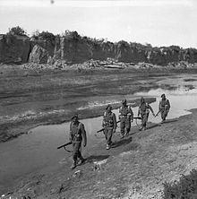 Men of the 5th/7th Battalion, Gordon Highlanders, on patrol in Wadi Zessar, Tunisia, 10 March 1943. The British Army in Tunisia 1943 NA1053.jpg