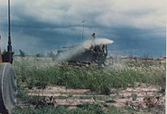 U.S. Army armored personnel carrier (APC) spraying Agent Orange over Vietnamese rice fields during the Vietnam War