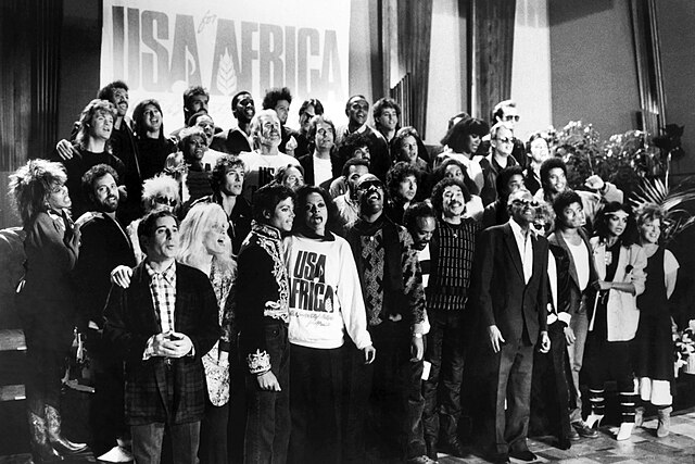 Joel (second row, second from left) with other musicians for the recording of "We Are the World" in 1985