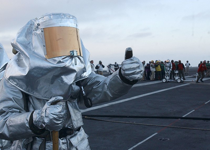 File:US Navy 030708-N-6713R-037 A member of the USS John C. Stennis (CVN 74) crash and salvage team gives the thumbs up to flight deck personnel during a simulated fire.jpg