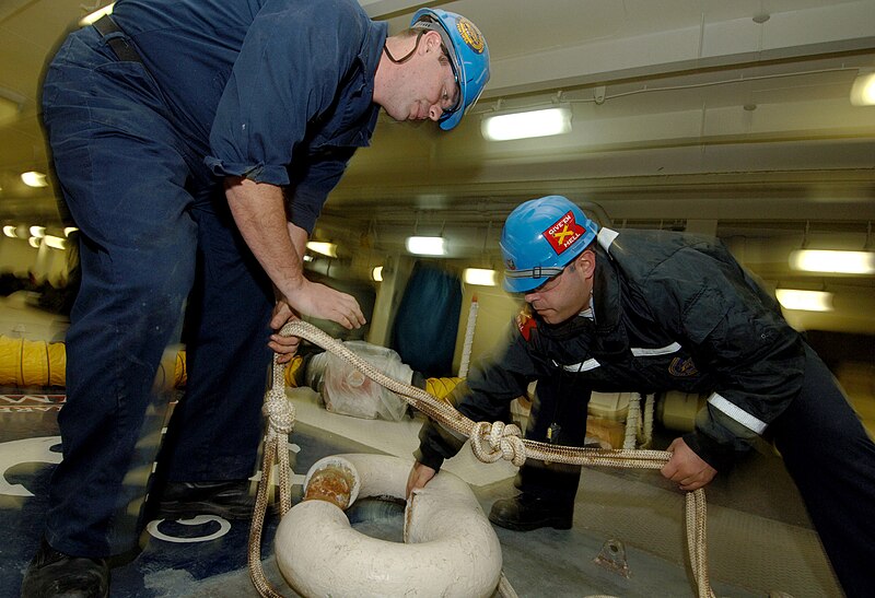 File:US Navy 060202-N-4757S-003 Boatswain's Mates aboard the Nimitz-class aircraft carrier USS Harry S. Truman (CVN 75) move a link of anchor chain in the foc'sle.jpg