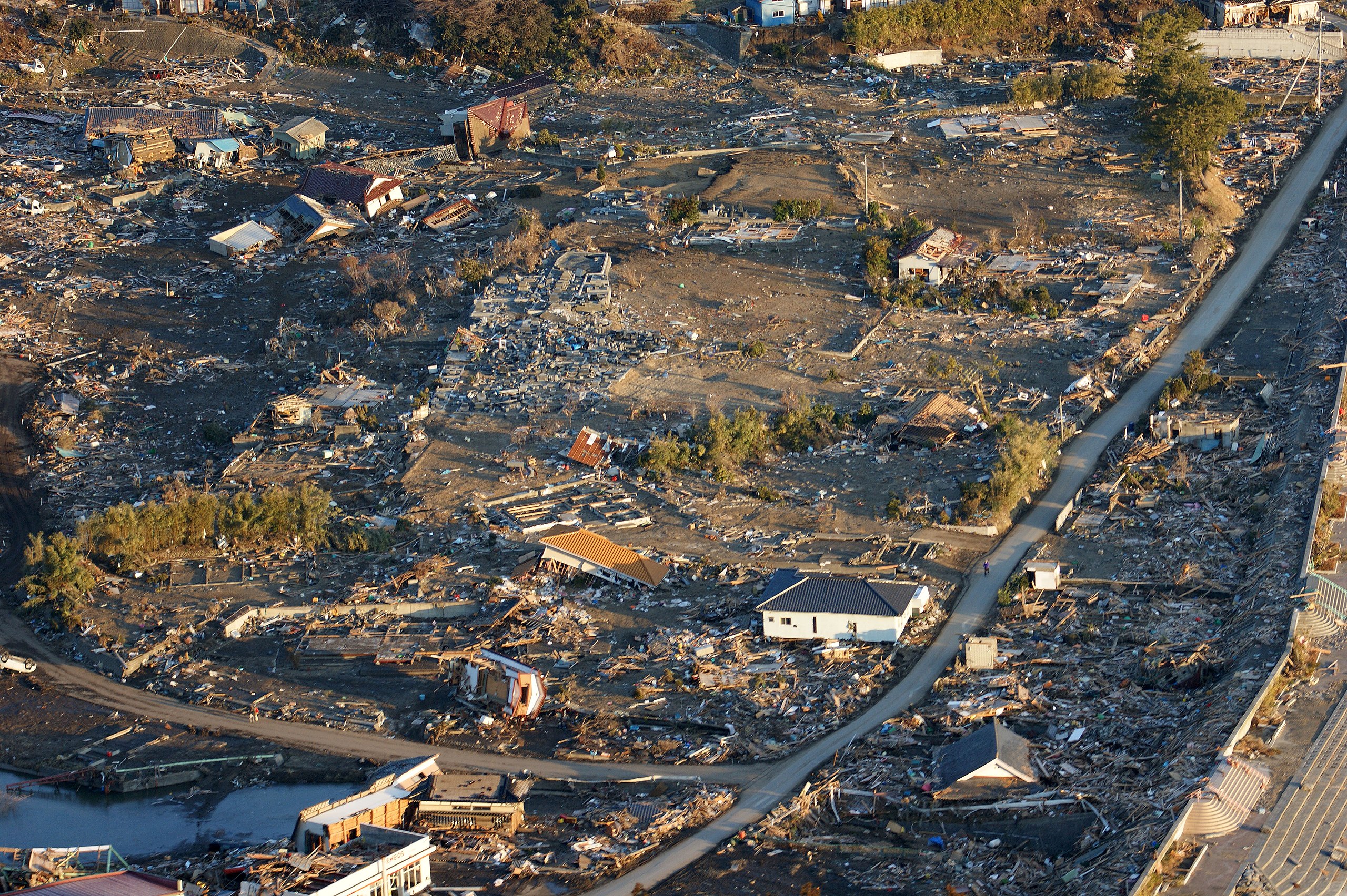 File:US Navy 110318-N-0076O-004 An aerial view of damage to 