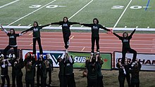 U of S Huskie cheerleader stunt UofSHuskyCheerleaders.jpg