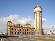 Wolfen, water tower and power plant on the site of the former ORWO film factory, producer of VISTRA synthetic fiber, a strategic material in German warfare, World War II. The plant was listed as a historic monument in Saxony-Anhalt. Photo: current view, 2007. Author: M_H.DE