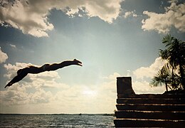 Young man jumping from wall at river bank into the Amazon river close to Belem, Brazil, September 1989.jpg