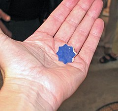 An eight sided star tile after being cut from a tile, a mainstay of Moorish/Islamic design
