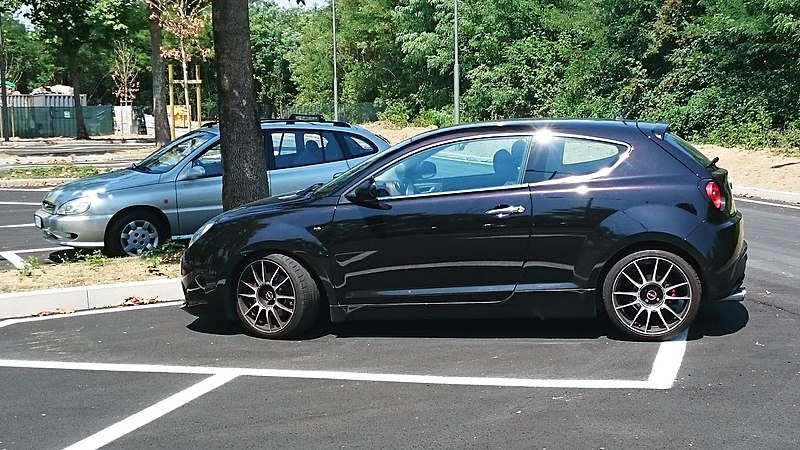 File:"15 - ITALY - Parked automobiles out of Museo Storico Alfa Romeo Milan - in this pics Alfa Romeo Mito black coupes side views facin left.jpg