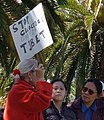 "STOP GENOCIDE IN COMMIE TIBET" sign detail at 2008 Olympic Torch Relay in SF - Embarcadero 03 (cropped).JPG