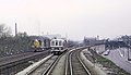 1 of 2 Photos. On the slide mount Roger wrote, "CTA Lake St. B-train racing C&NW freight near Laramie Ave., Chicago, IL in May 1967." (25526453680).jpg