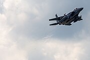 An F-15E Strike Eagle, tail number 91-0320, taking off from RAF Lakenheath in England. The aircraft is assigned to the 494th Fighter Squadron.