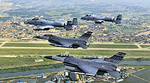 Two Fairchild Republic A-10A Thunderbolt IIs from the 25th Fighter Squadron and two F-16 Fighting Falcons from the 36th Fighter Squadron fly over Osan AB in formation, 2010 51st FW F-16 A-10 Formation over Osan AB.jpg