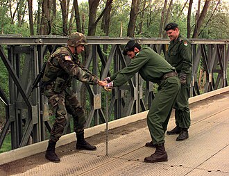 A member of the battalion working with Hungarian Army Engineers on the Brcko Bridge in Bosnia and Herzegovina, on 26 April 1999 990426-A-1958F-003 - U.S. soldier assists Hungarian Army engineers in repairing Brcko Bridge in Bosnia and Herzegovina.jpg