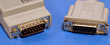 AUI Connectors. The male connector (left) is on the MAU and the female connector (right) is on the MAC device (normally either a computer or an Ethernet hub). Note the sliding clip. AUI Connectors.jpg