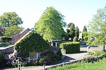 A typical house in Cleish with Cleish Cemetery beyond A typical house in Cleish with Cleish Cemetery beyond.jpg