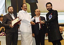 Dhar receiving the Best Director Award for Uri: The Surgical Strike at 66th National Film Awards