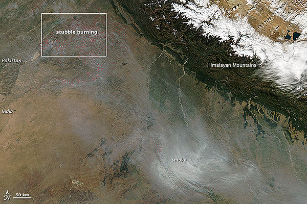 During the autumn and spring months, some 500 million tons of rice and wheat crop residues are burnt, and winds blow from India's north and northwest towards east.[46][47][48] This aerial view shows India's annual crop burning, resulting in smoke and air pollution over Delhi and adjoining areas.