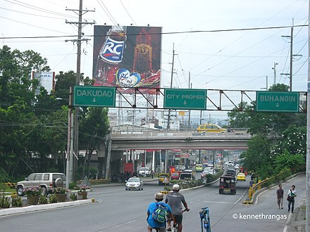 N1/AH26 (Pan-Philippine Highway) as J.P. Laurel Avenue crossing the Bajada Flyover, which carries N918 (Buhangin–Lapanday Road), in Davao City