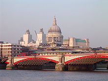 Blackfriars Bridge with St Paul's Cathedral behind Blackfriars Bridge, River Thames, London, with St Pauls Cathedral.jpg