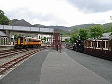 The station is served by mainline standard gauge DMUs and narrow gauge trains of the Ffestiniog Railway