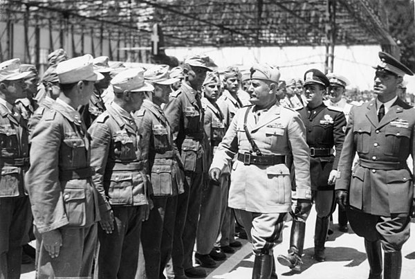 Mussolini visits a naval base and honours the participants in the Battle of Pantelleria, 25 June 1942. Il Duce is accompanied by Aldo Vidussoni the pa