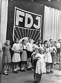 Inauguration ceremony of the FDJ ("Freie Deutsche Jugend", the GDR's official youth movement) at Alter Friedrichstadt-Palast in 1947. Bundesarchiv Bild 183-T1017-326, Friedrichstadtpalast, Grundungsfeier der FDJ-Berlin.jpg