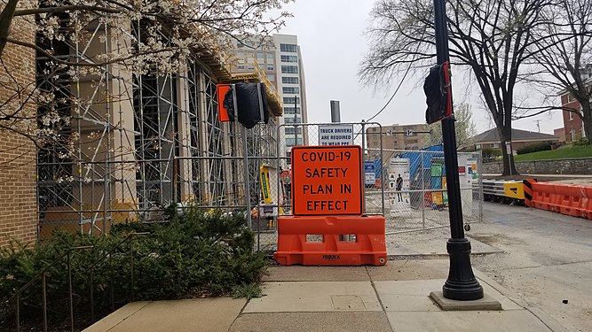 A sign on a construction site for COVID-19 in State College, Pennsylvania.