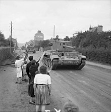 Challenger tanks of 2nd Northamptonshire Yeomanry, 11th Armoured Division, passing through Flers on 17 August 1944 Challenger and Cromwell tanks Flers Aug 1944 IWM B 9331.jpg