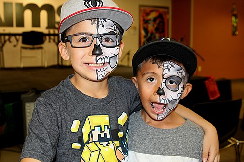 Two Mexican American boys at a Día de Los Muertos celebration in Greeley, Colorado