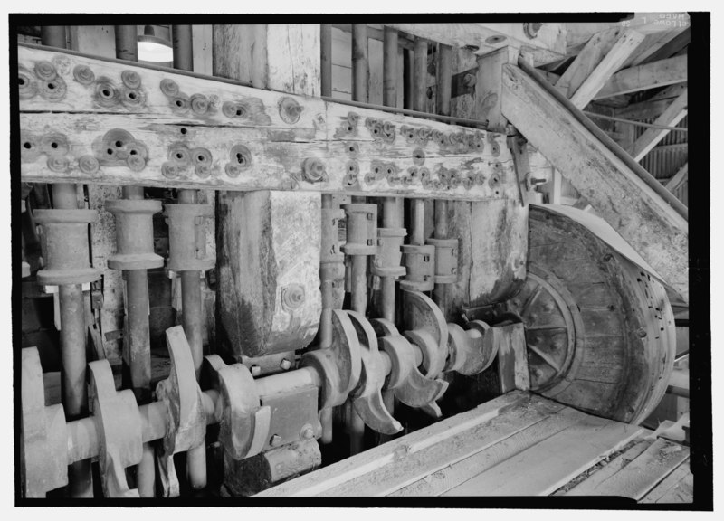 File:DETAIL VIEW OF THE STAMP BATTERIES SHOWING THE SUPPORT STRUCTURE, CAMS, TAPPETS ON THE STAMP SHAFTS AND ONE OF THE TWO DRIVE WHEELS. - Standard Gold Mill, East of Bodie Creek, Northeast HAER CA-299-43.tif