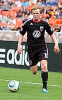 Dax McCarty dribbles the ball during a match against the Houston Dynamo at RFK Stadium