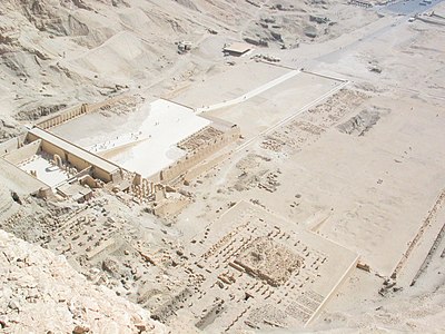 The three temples at Deir el Bahari from the top of the cliff behind them, part of Hatshepsut's temple on left, Tuthmosis III's temple in center, and Mentuhotep II's temple on right