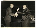 Wu Zhihui, chairman of the National Constituent Assembly, handed the ratified constitution to Chiang Kai-shek, chairman of the Nationalist Government.