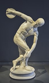 A marble statue of a man throwing a disc